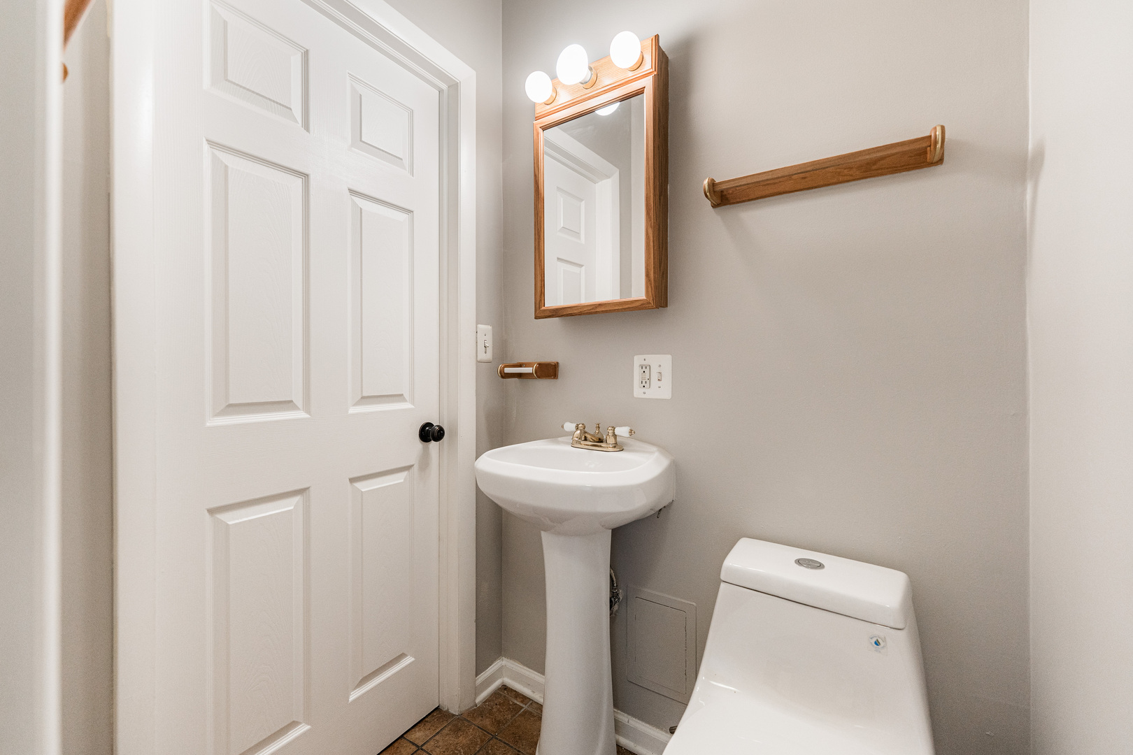 2916 West Warren Boulevard, Unit 1 Chicago, IL 60612 - Photo 11 of 16 a bathroom with a sink a toilet and mirror