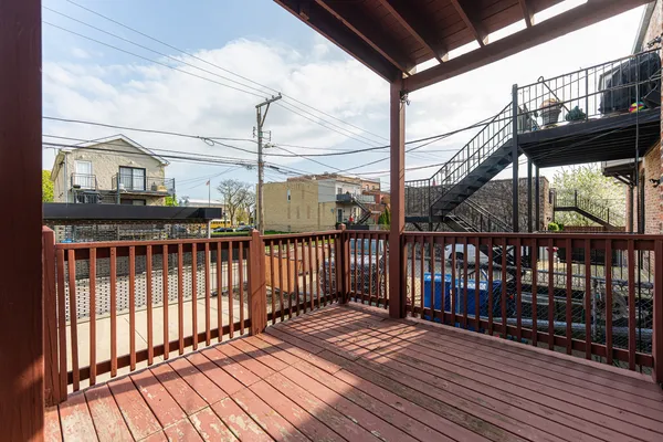 a view of balcony with wooden floor