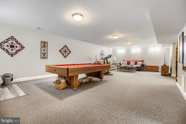 a room with a car and furniture