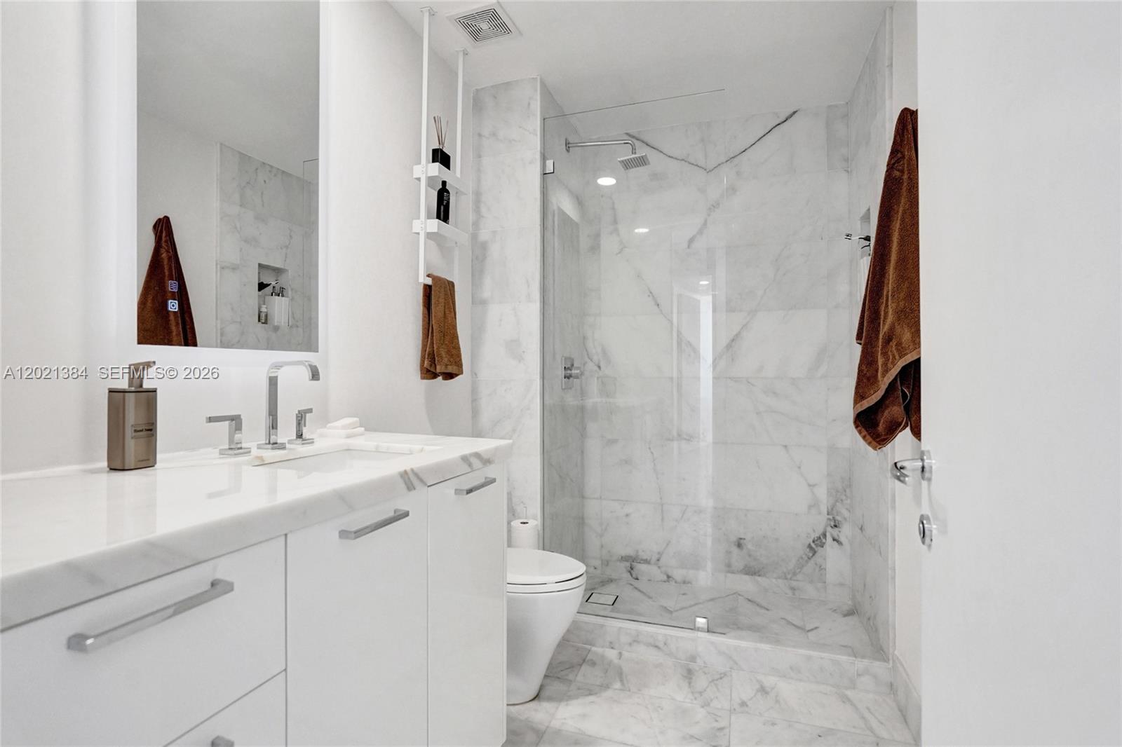 400 Alton Road, Unit PH11 Miami Beach, FL 33139 - Photo 38 of 49 a bathroom with a granite countertop sink toilet and shower
