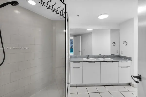 a bathroom with a sink a vanity and a mirror