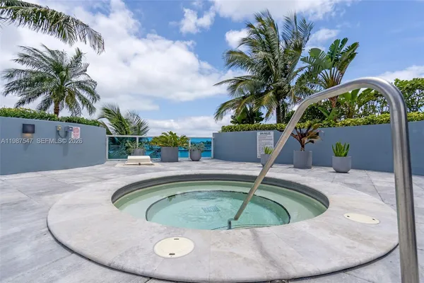 a view of a swimming pool with a plants