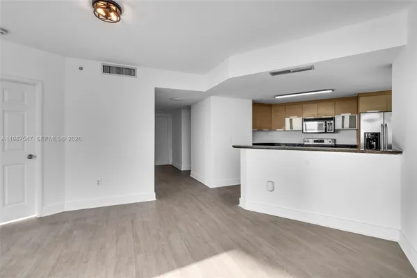 a view of kitchen with wooden floor