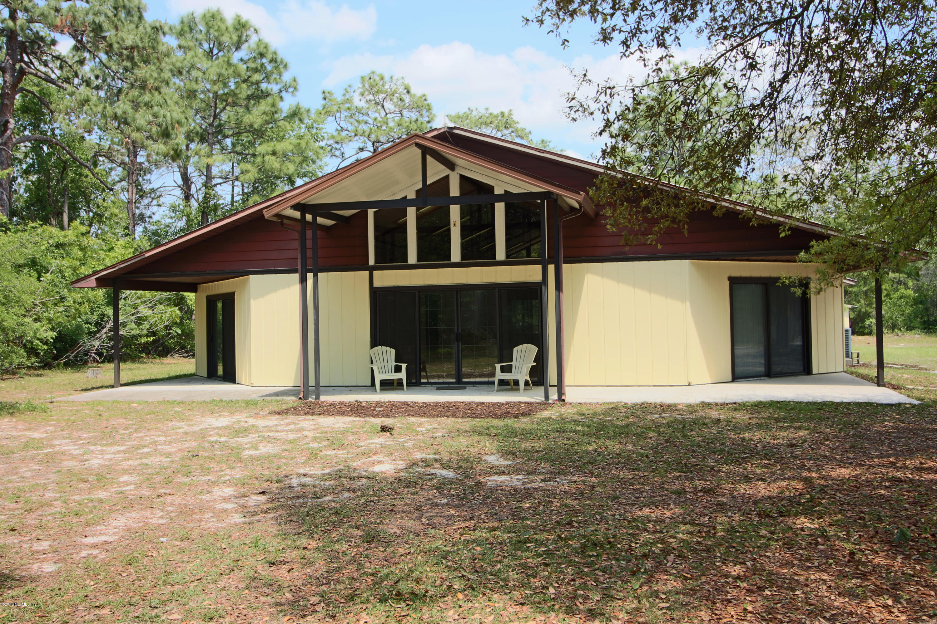 7705 Ranchette Road Keystone Heights, FL 32656 - Photo 1 of 29 a house with yard in front of it