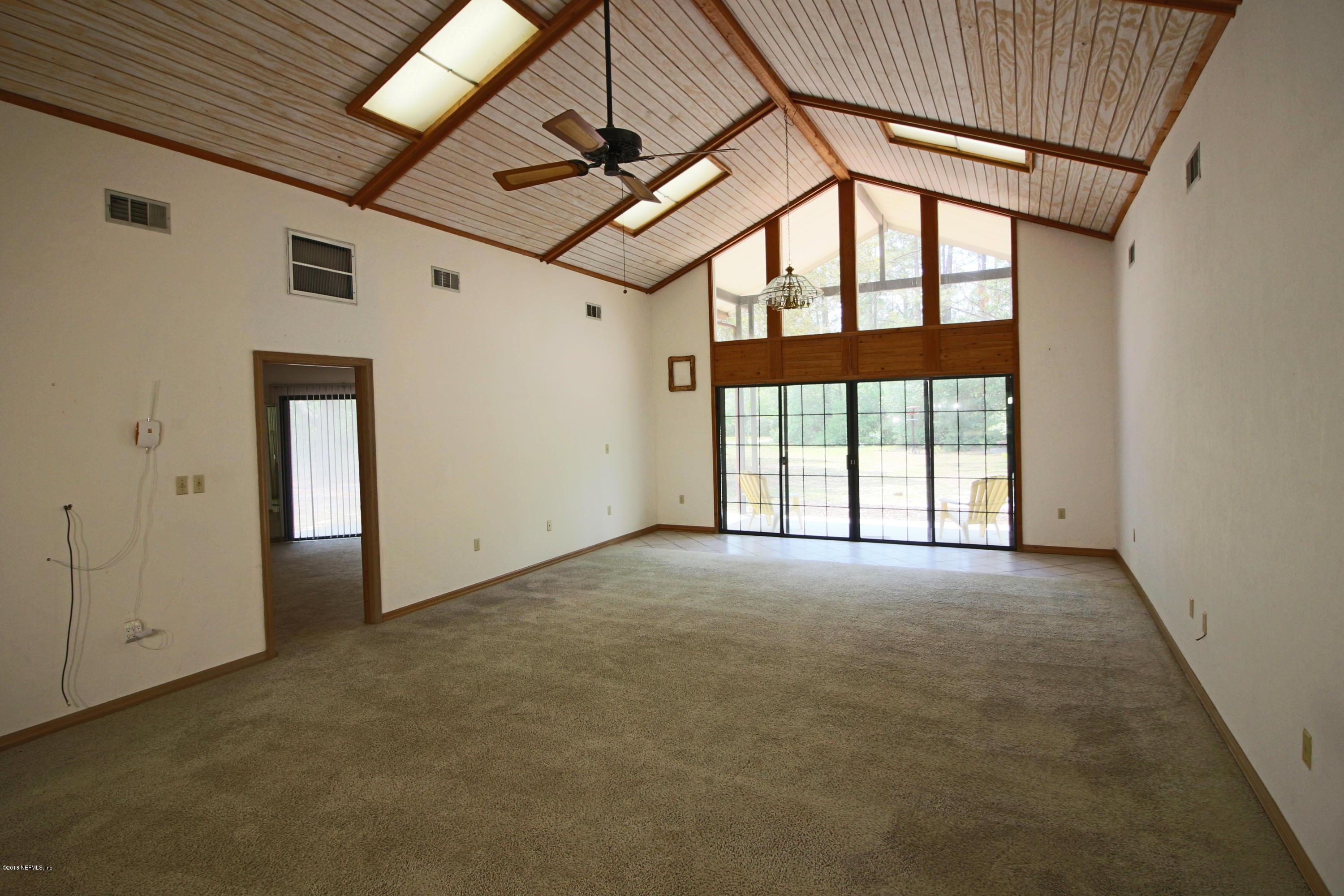 7705 Ranchette Road Keystone Heights, FL 32656 - Photo 5 of 29 an empty room with windows