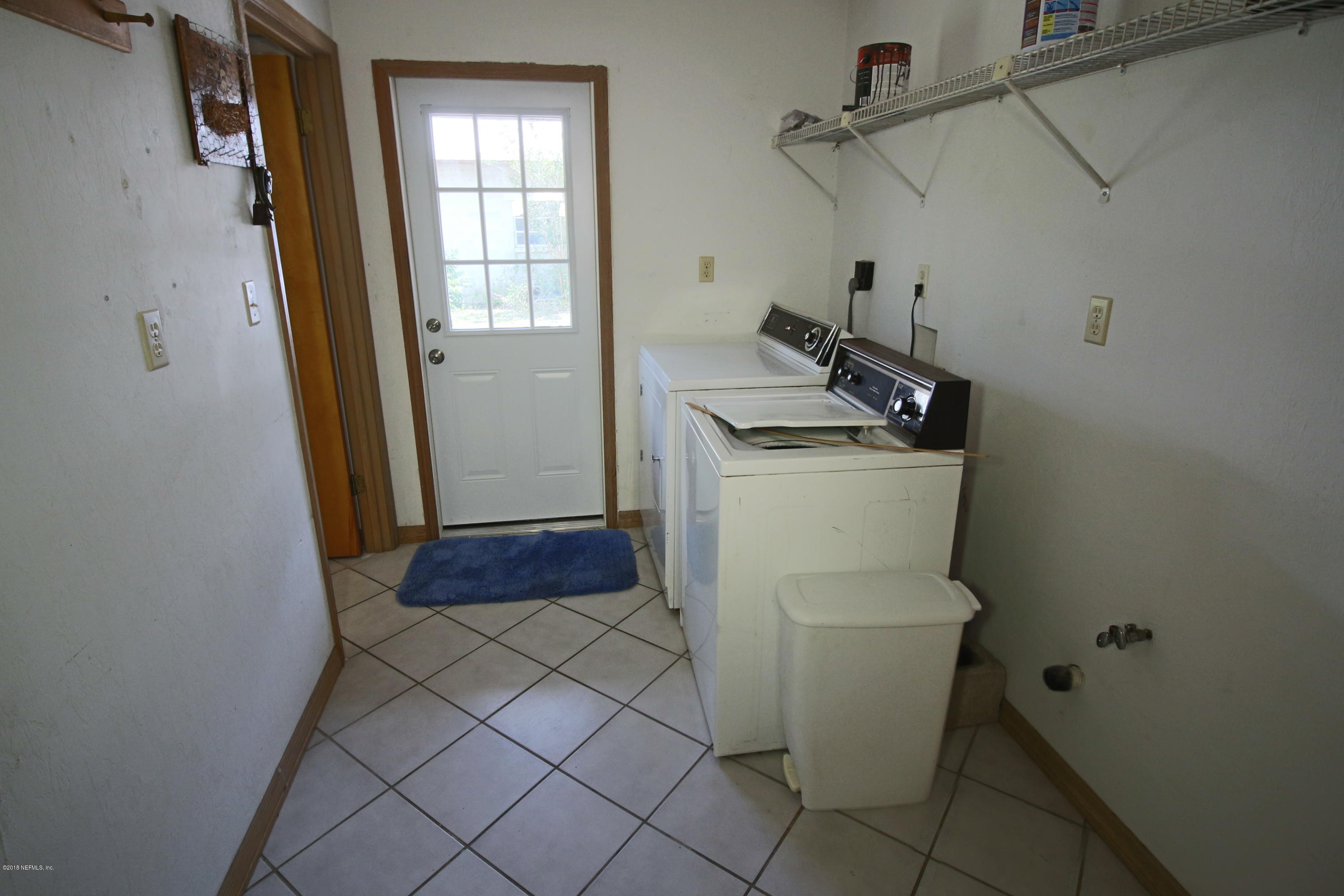 7705 Ranchette Road Keystone Heights, FL 32656 - Photo 8 of 29 a utility room with dryer and washer