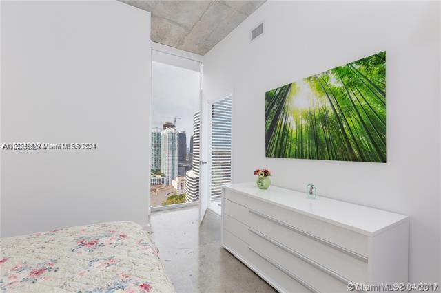 151 Southeast 1st Street, Unit 2811 Miami, FL 33131 - Photo 6 of 18 a bathroom with a sink and a large mirror