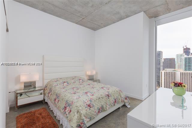 151 Southeast 1st Street, Unit 2811 Miami, FL 33131 - Photo 7 of 18 a bedroom with a bed and window