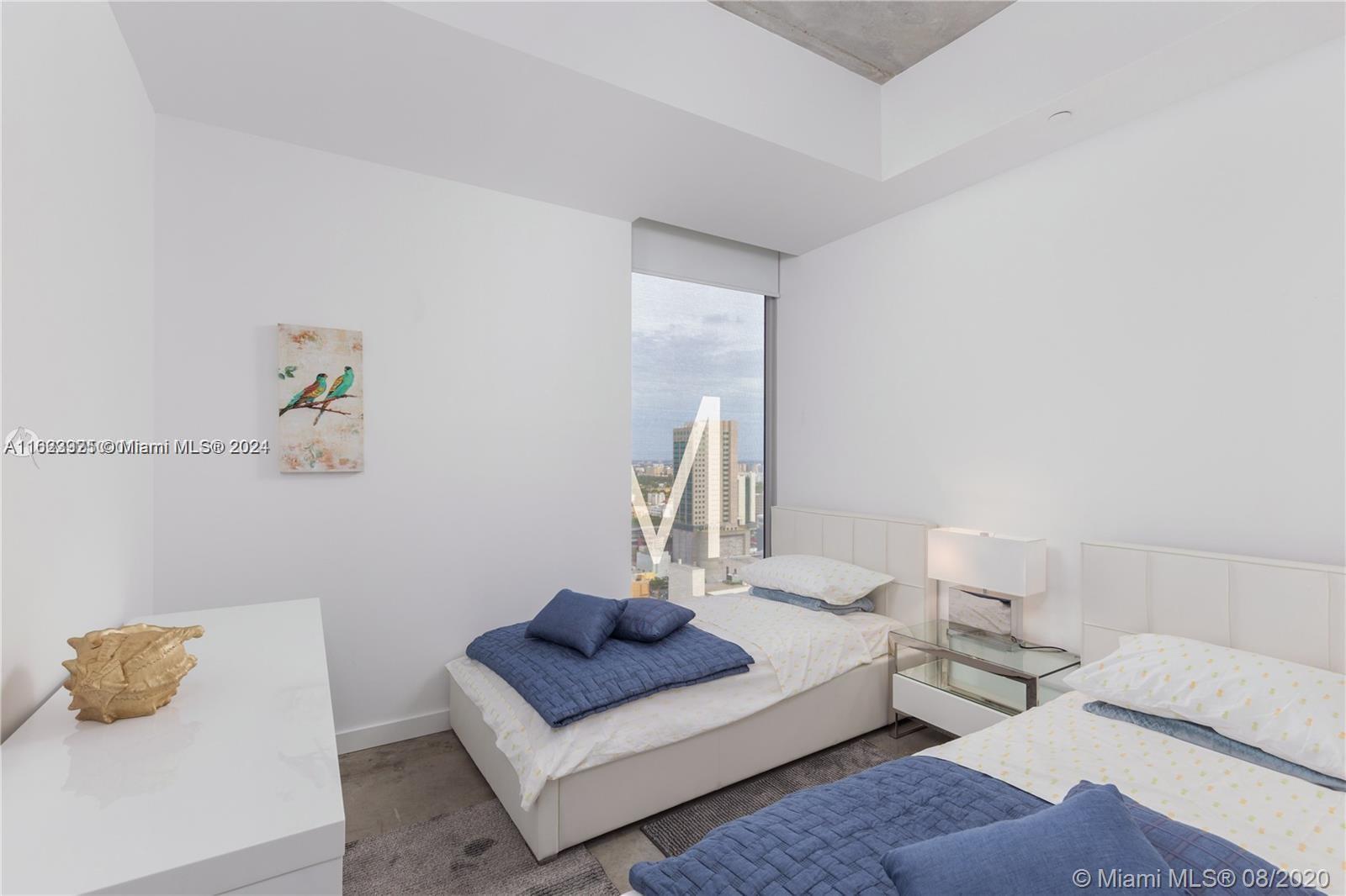 151 Southeast 1st Street, Unit 2811 Miami, FL 33131 - Photo 10 of 18 a living room with furniture and a couch