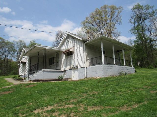 428 Grindstone Road Grindstone, PA 15442 - Photo 2 of 15 a view of a house with a yard and sitting area