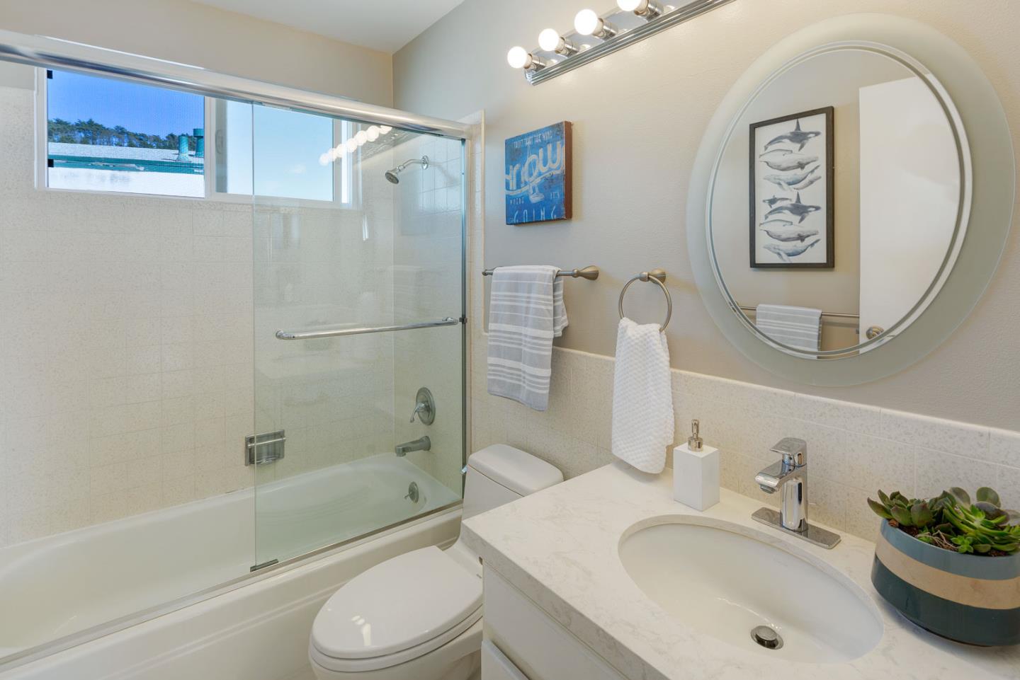 17 Moon Gate Court Pacifica, CA 94044 - Photo 17 of 36 a bathroom with a sink toilet and shower
