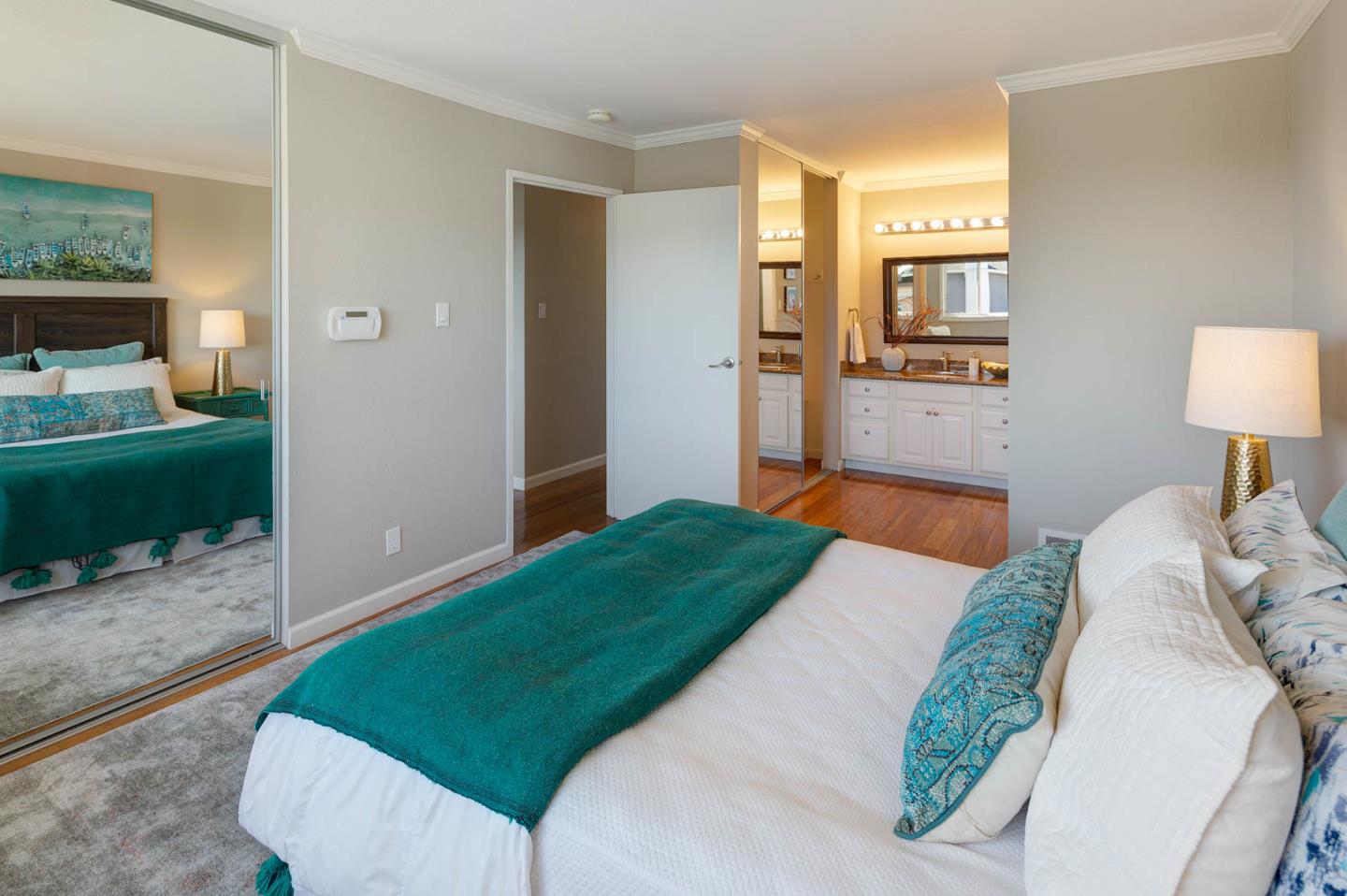 17 Moon Gate Court Pacifica, CA 94044 - Photo 22 of 36 a bedroom with a bed and a view of living room