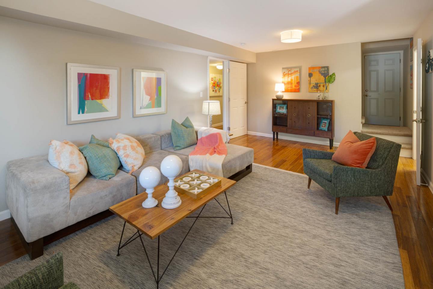 17 Moon Gate Court Pacifica, CA 94044 - Photo 28 of 36 a living room with furniture and a wooden floor