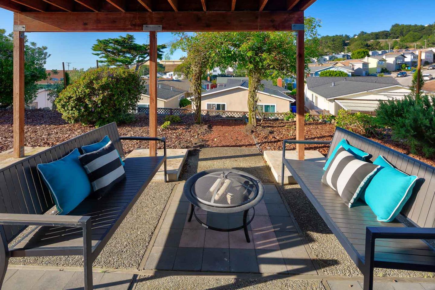 17 Moon Gate Court Pacifica, CA 94044 - Photo 34 of 36 a view of a patio with table and chairs potted plants and palm tree