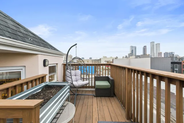 a view of roof deck with patio