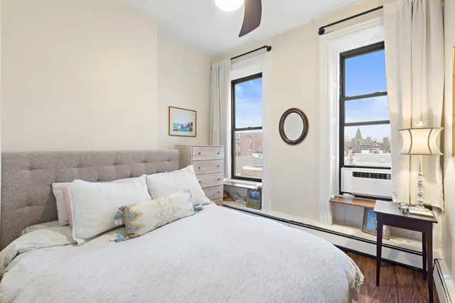 a bedroom with bed and a window