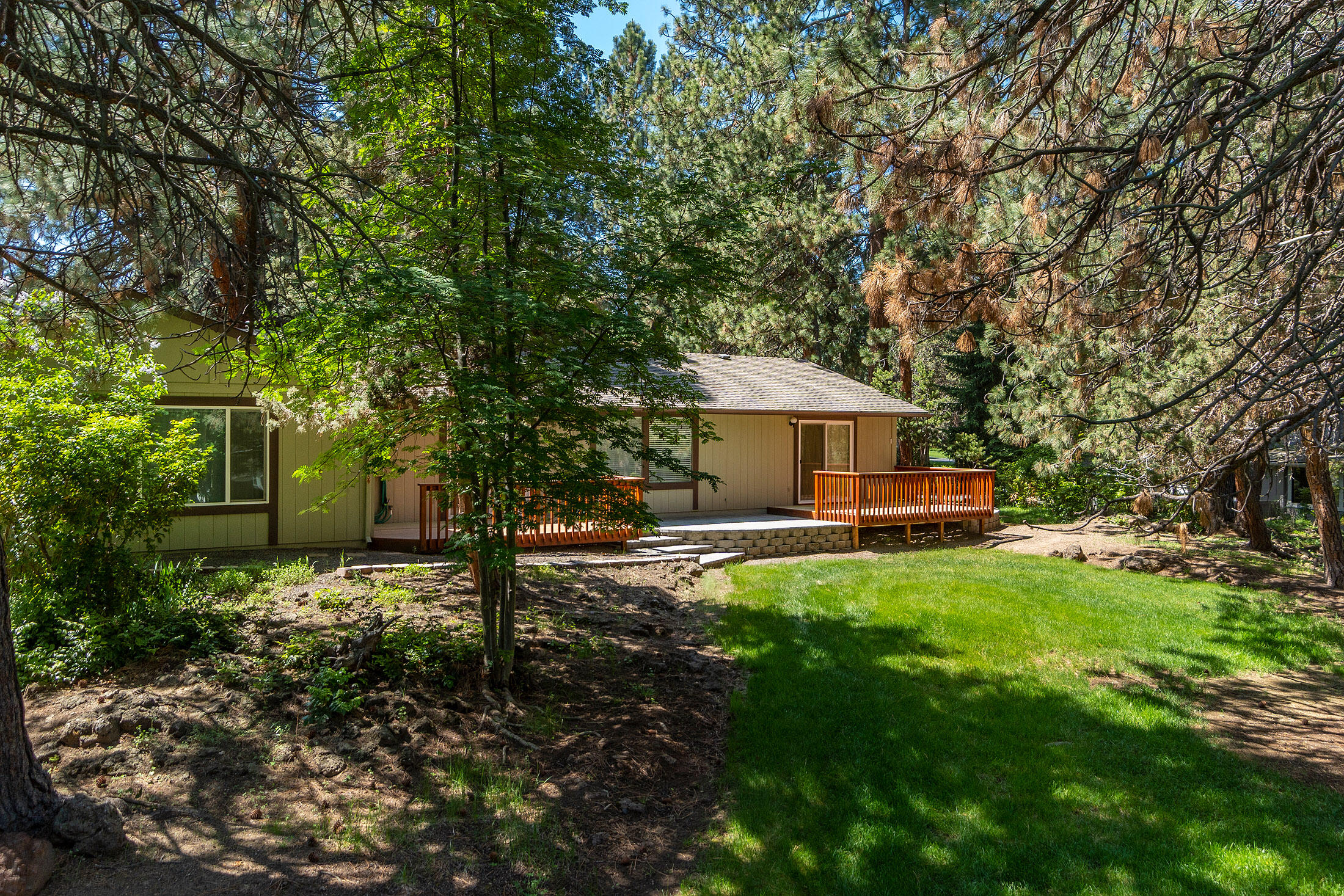 20420 Mainline Road Bend, OR 97702 - Photo 24 of 29 a front view of a house with yard patio and green space