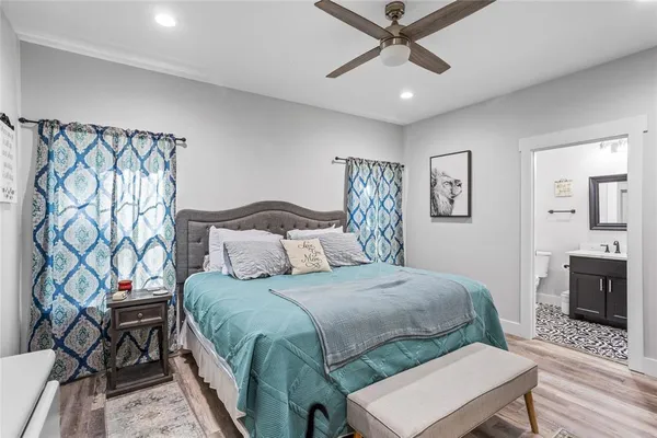 a bedroom with a bed and a table in it