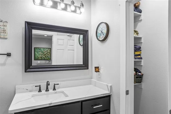 a bathroom with a sink and a mirror