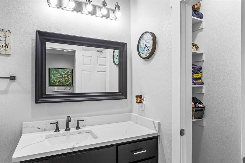 1685 Fleming Road Bells, TX 75414 - Photo 15 of 30 a bathroom with a sink and a mirror