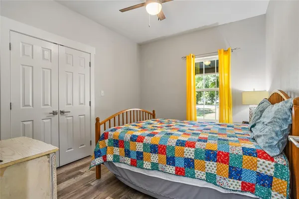a bedroom with a bed and a window