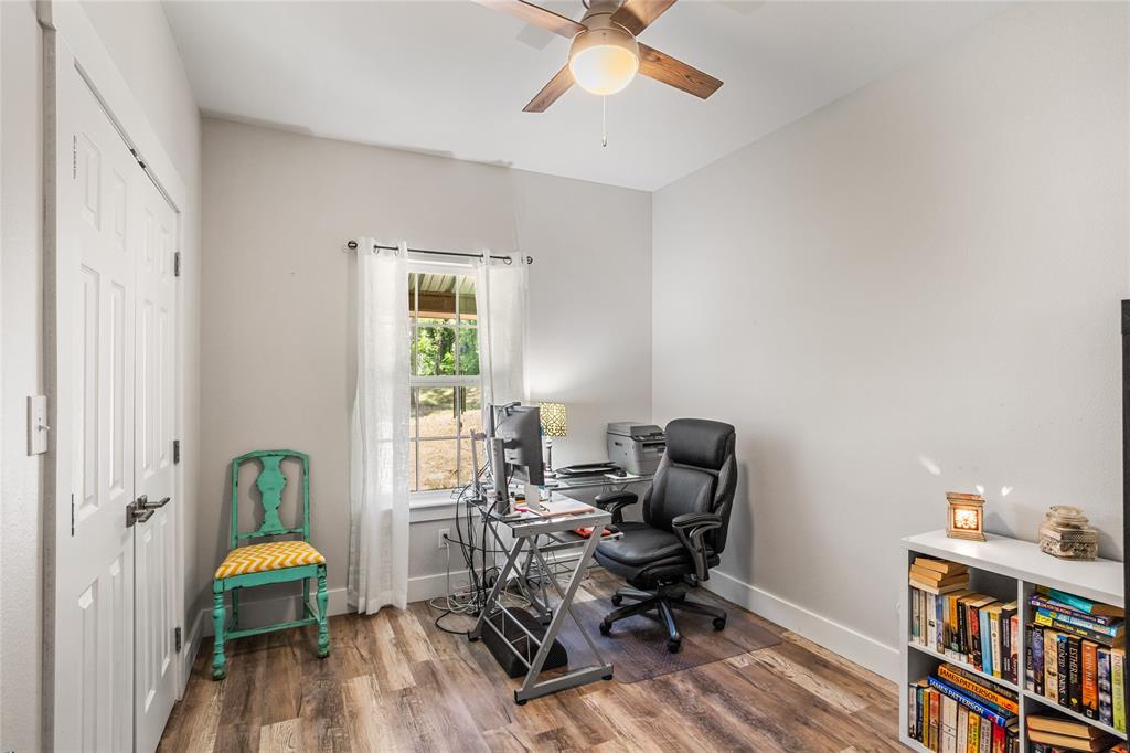 1685 Fleming Road Bells, TX 75414 - Photo 17 of 30 a view of a workspace with furniture and a window