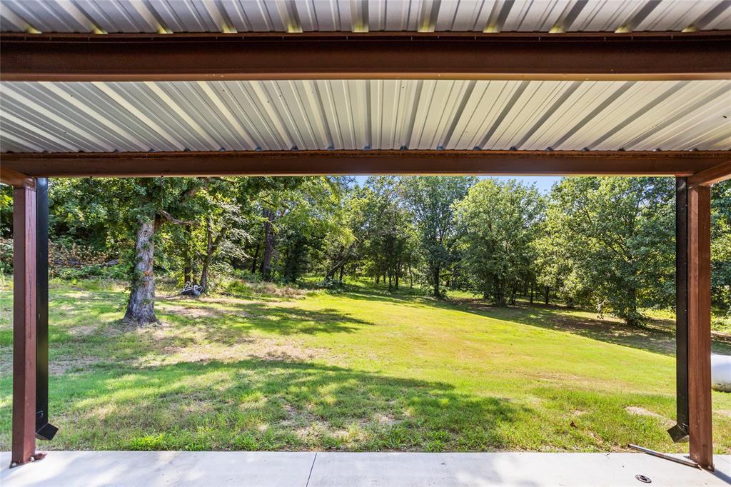 1685 Fleming Road Bells, TX 75414 - Photo 20 of 30 a view of a room with wooden floor and outdoor space