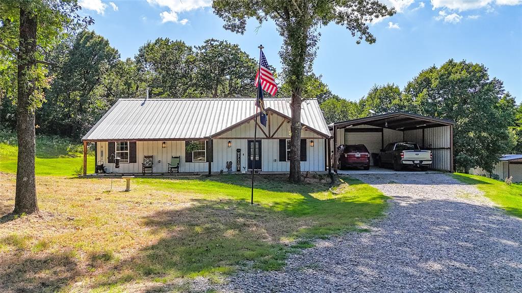 1685 Fleming Road Bells, TX 75414 - Photo 26 of 30 a view of a house with swimming pool and a small yard