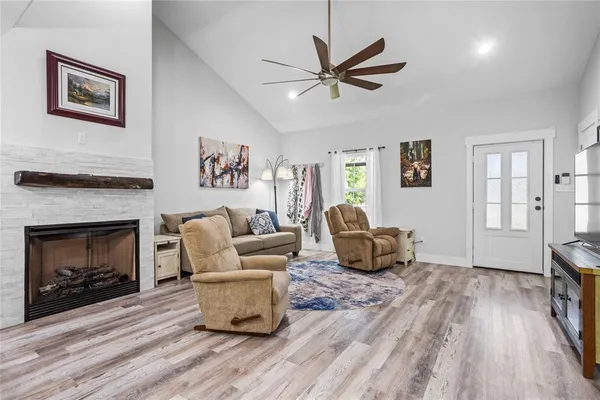 a living room with furniture and a fireplace