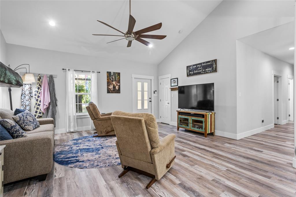 1685 Fleming Road Bells, TX 75414 - Photo 7 of 30 a living room with furniture and a flat screen tv