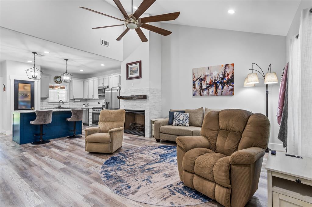 1685 Fleming Road Bells, TX 75414 - Photo 8 of 30 a living room with furniture and a fireplace