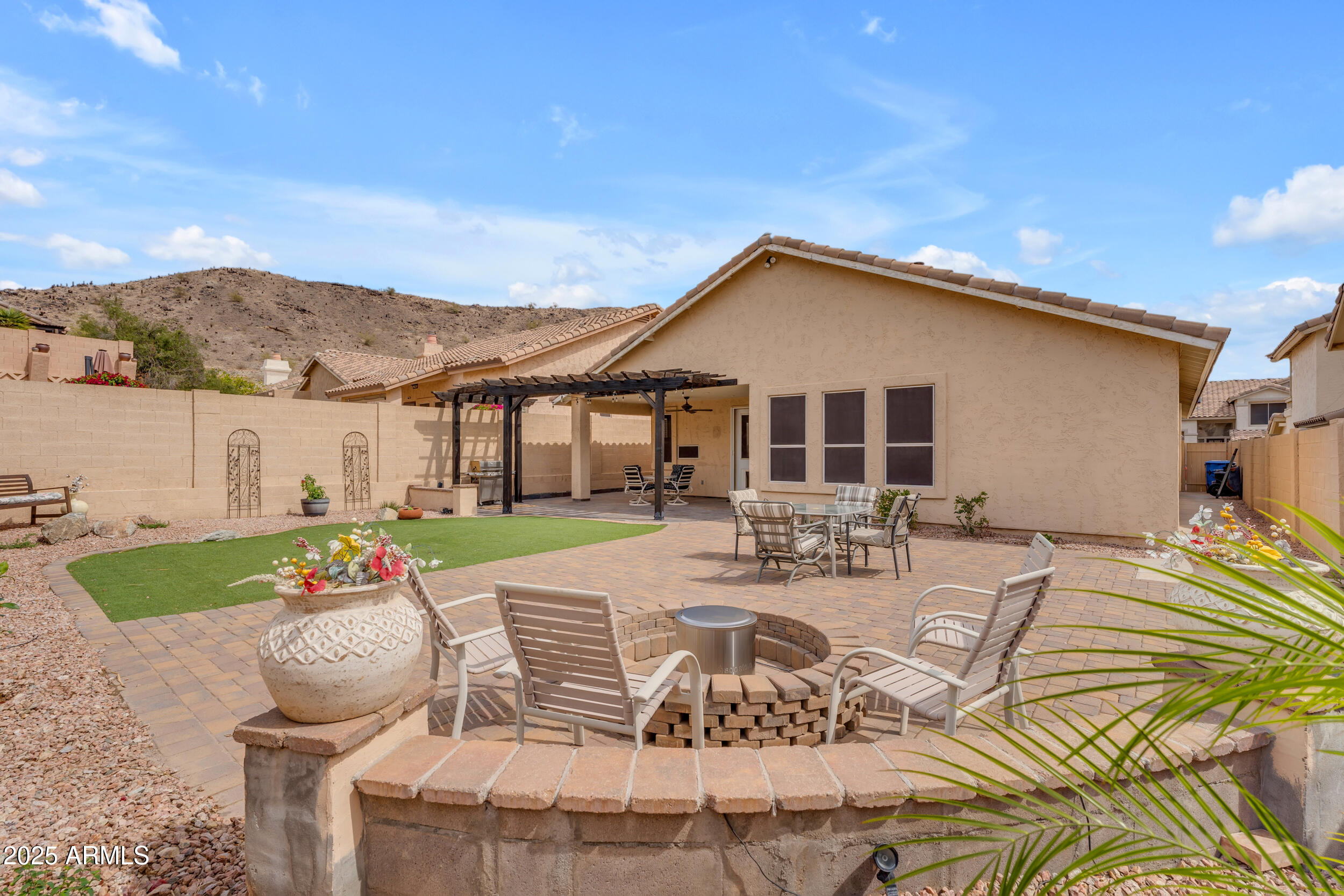 16044 South 24th Place Phoenix, AZ 85048 - Photo 1 of 42 a view of a house with backyard and sitting area
