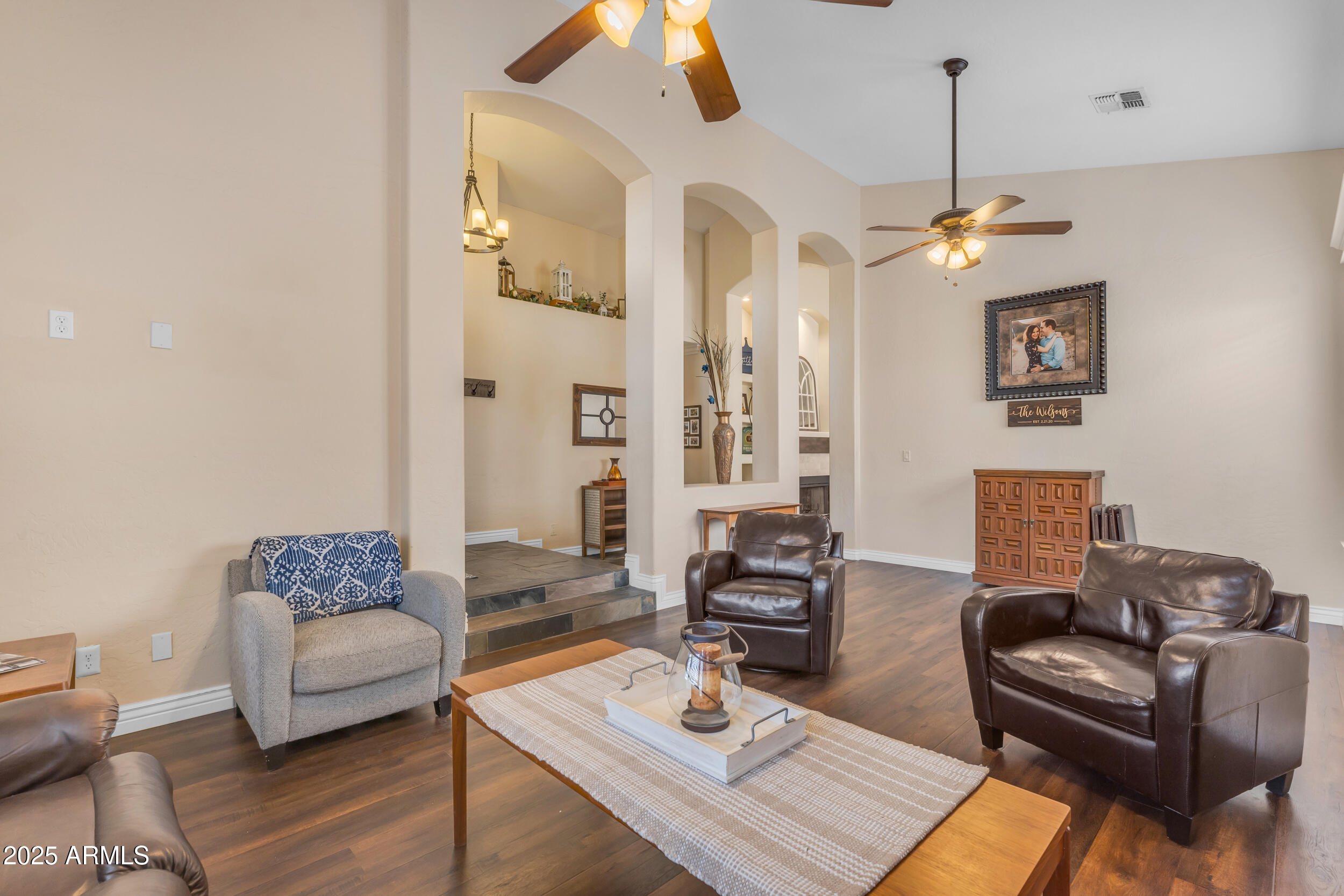 16044 South 24th Place Phoenix, AZ 85048 - Photo 9 of 42 a living room with furniture a couch and wooden floor