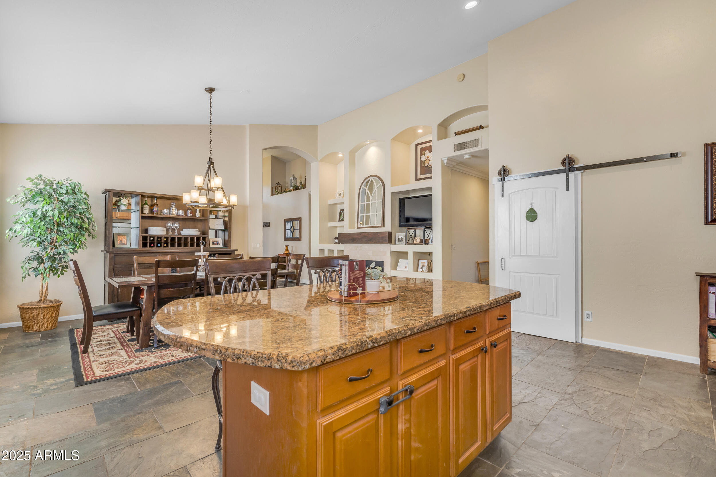 16044 South 24th Place Phoenix, AZ 85048 - Photo 16 of 42 a kitchen with stainless steel appliances granite countertop a sink and a refrigerator