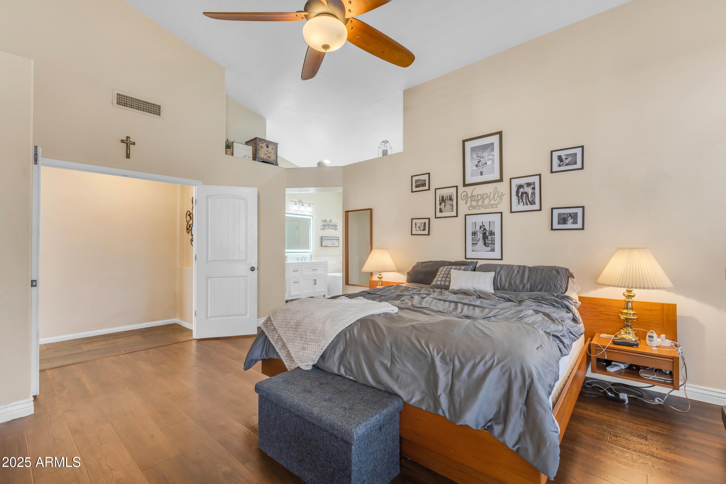 16044 South 24th Place Phoenix, AZ 85048 - Photo 18 of 42 a bedroom with a bed and wooden floor