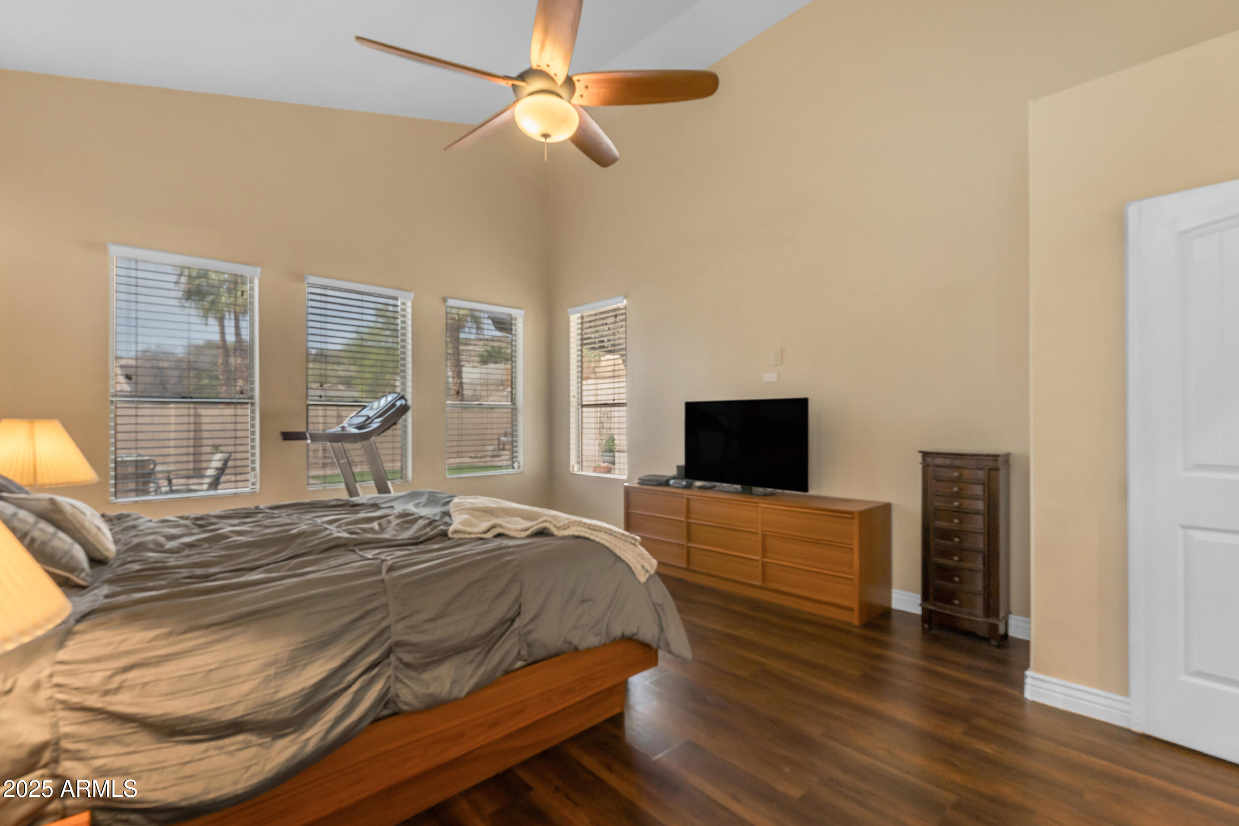 16044 South 24th Place Phoenix, AZ 85048 - Photo 19 of 42 a bedroom with a bed and a flat screen tv