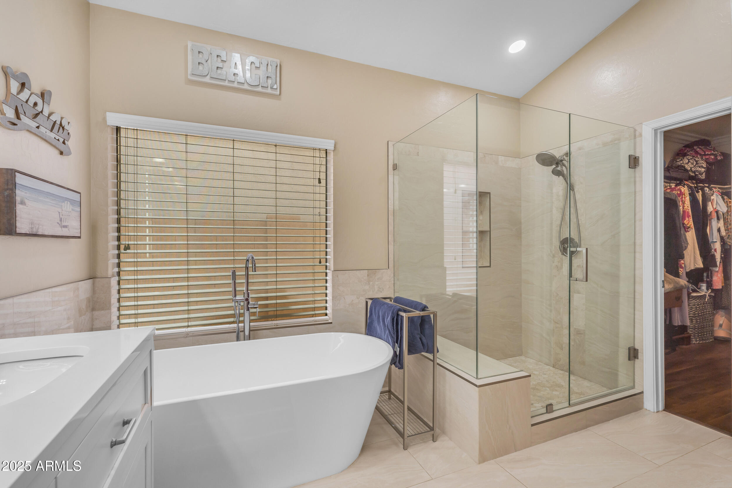 16044 South 24th Place Phoenix, AZ 85048 - Photo 21 of 42 a bathroom with a bathtub and a shower