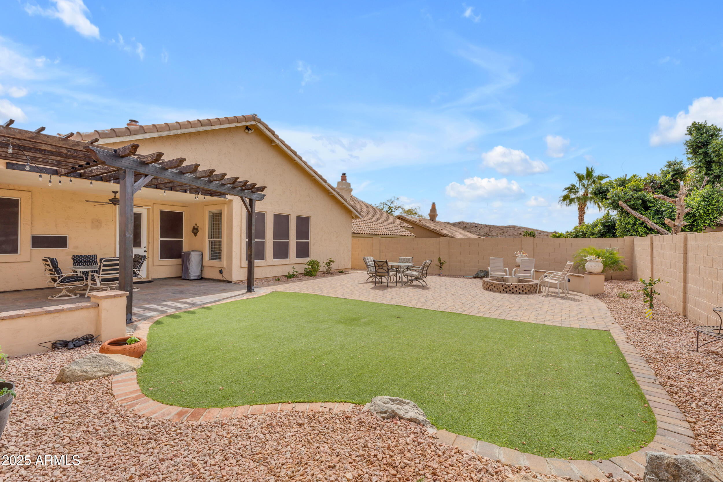 16044 South 24th Place Phoenix, AZ 85048 - Photo 30 of 42 a view of a house with a backyard porch and sitting area