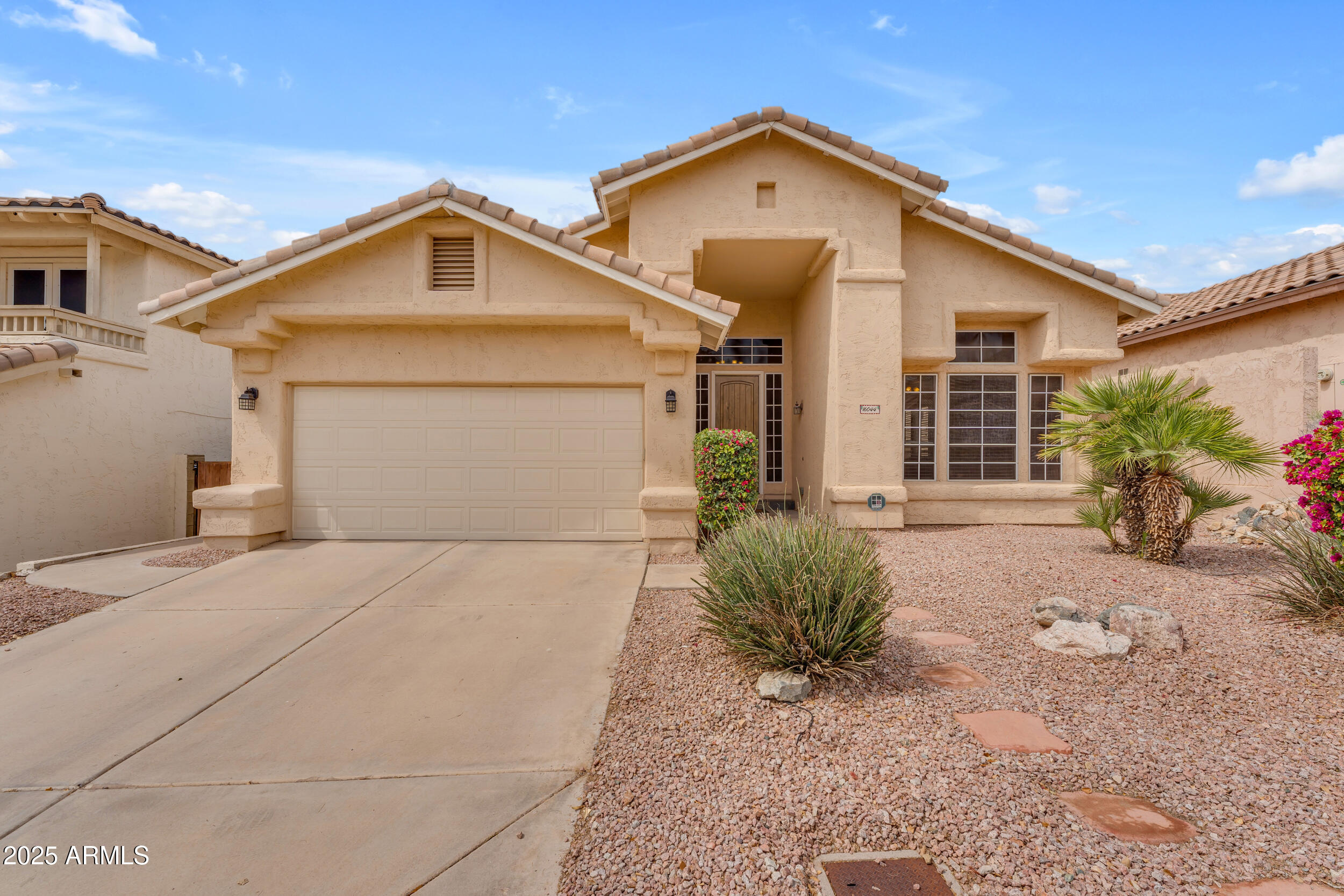 16044 South 24th Place Phoenix, AZ 85048 - Photo 32 of 42 a view of a house with a yard