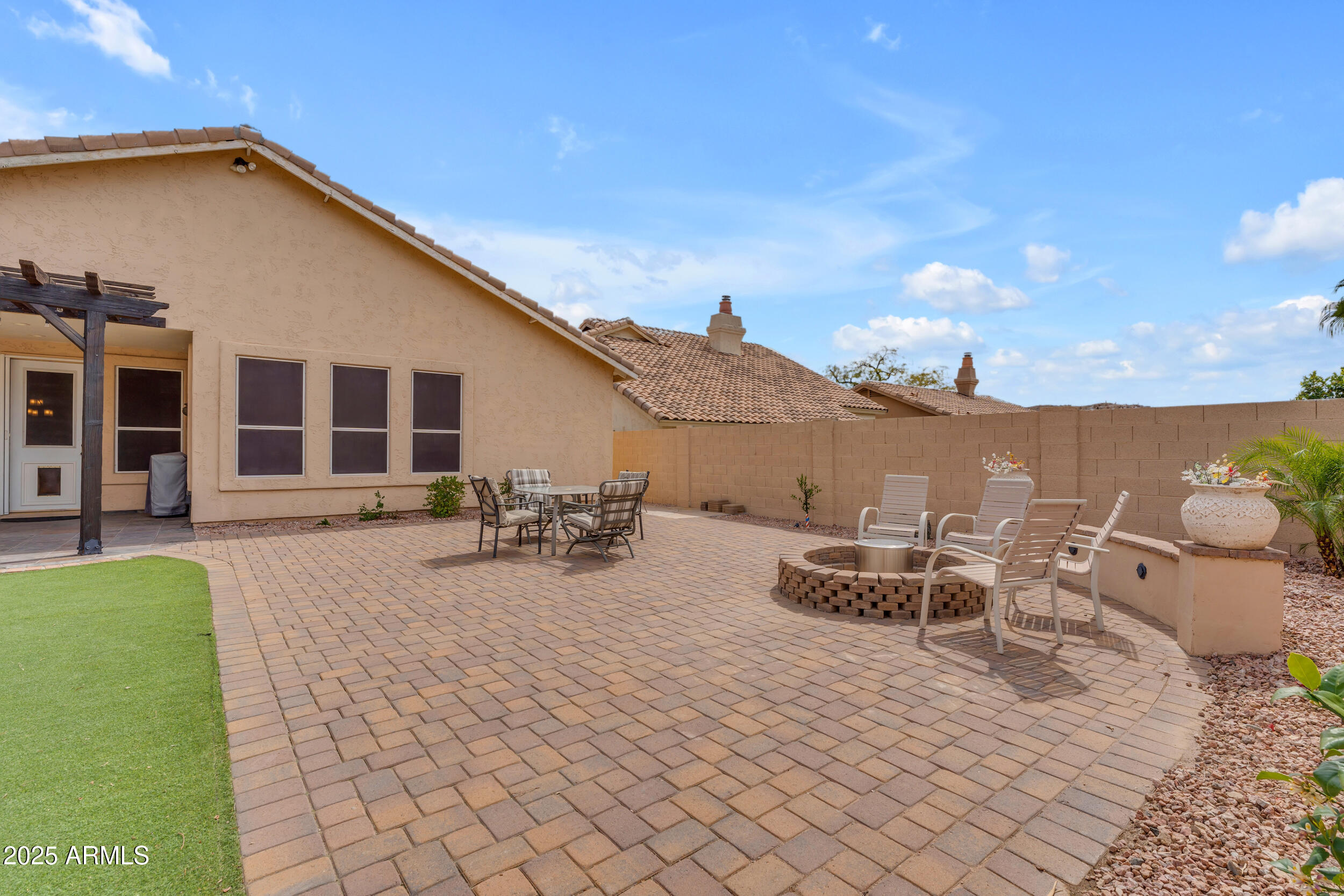 16044 South 24th Place Phoenix, AZ 85048 - Photo 33 of 42 a view of a patio with table and chairs and potted plants