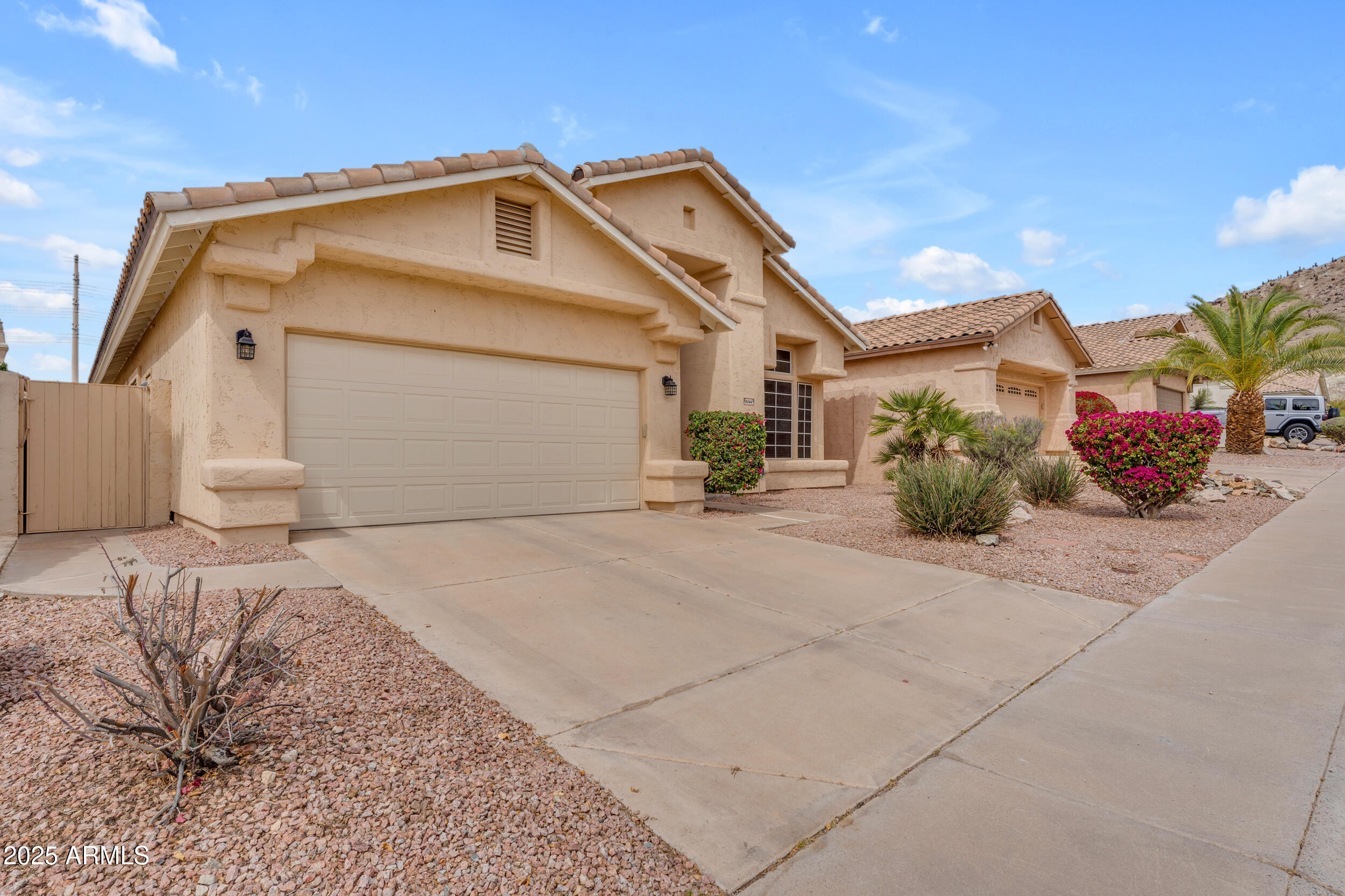 16044 South 24th Place Phoenix, AZ 85048 - Photo 35 of 42 a front view of a house with a yard