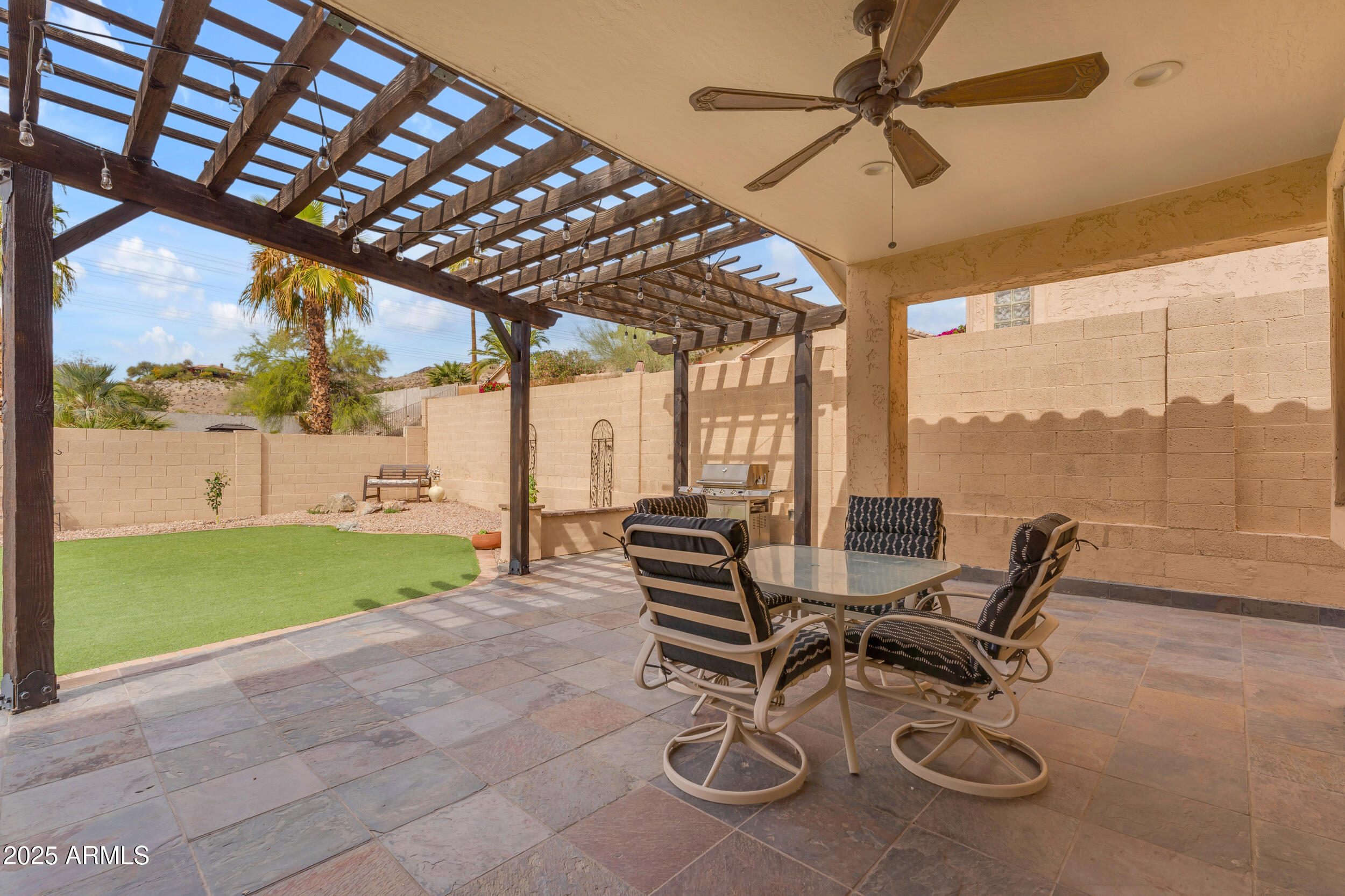 16044 South 24th Place Phoenix, AZ 85048 - Photo 36 of 42 a view of an chairs and table in the patio