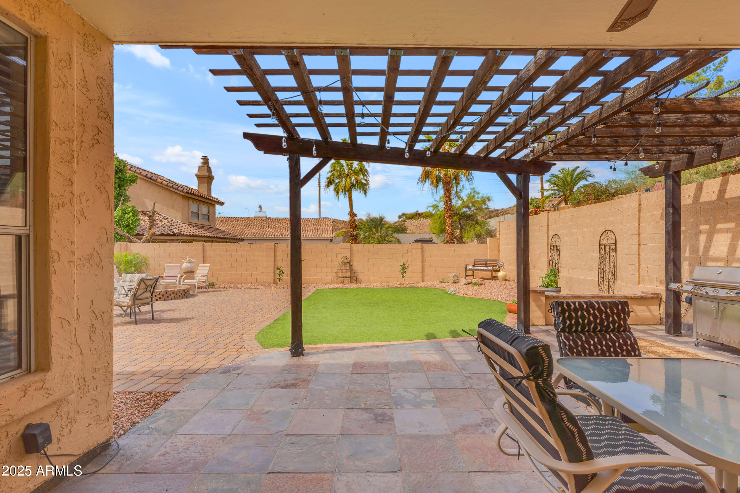 16044 South 24th Place Phoenix, AZ 85048 - Photo 37 of 42 a view of porch with a table and chairs