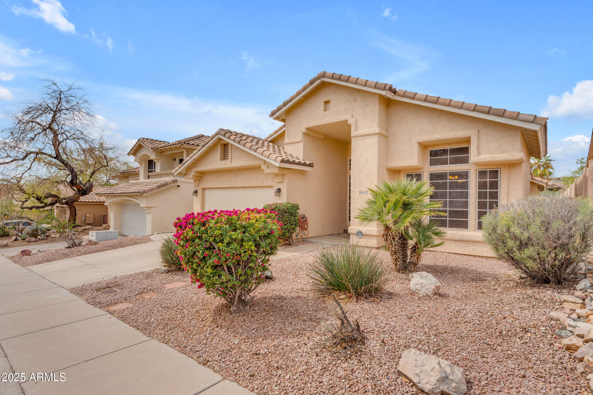 16044 South 24th Place Phoenix, AZ 85048 - Photo 39 of 42 a front view of a house with a yard