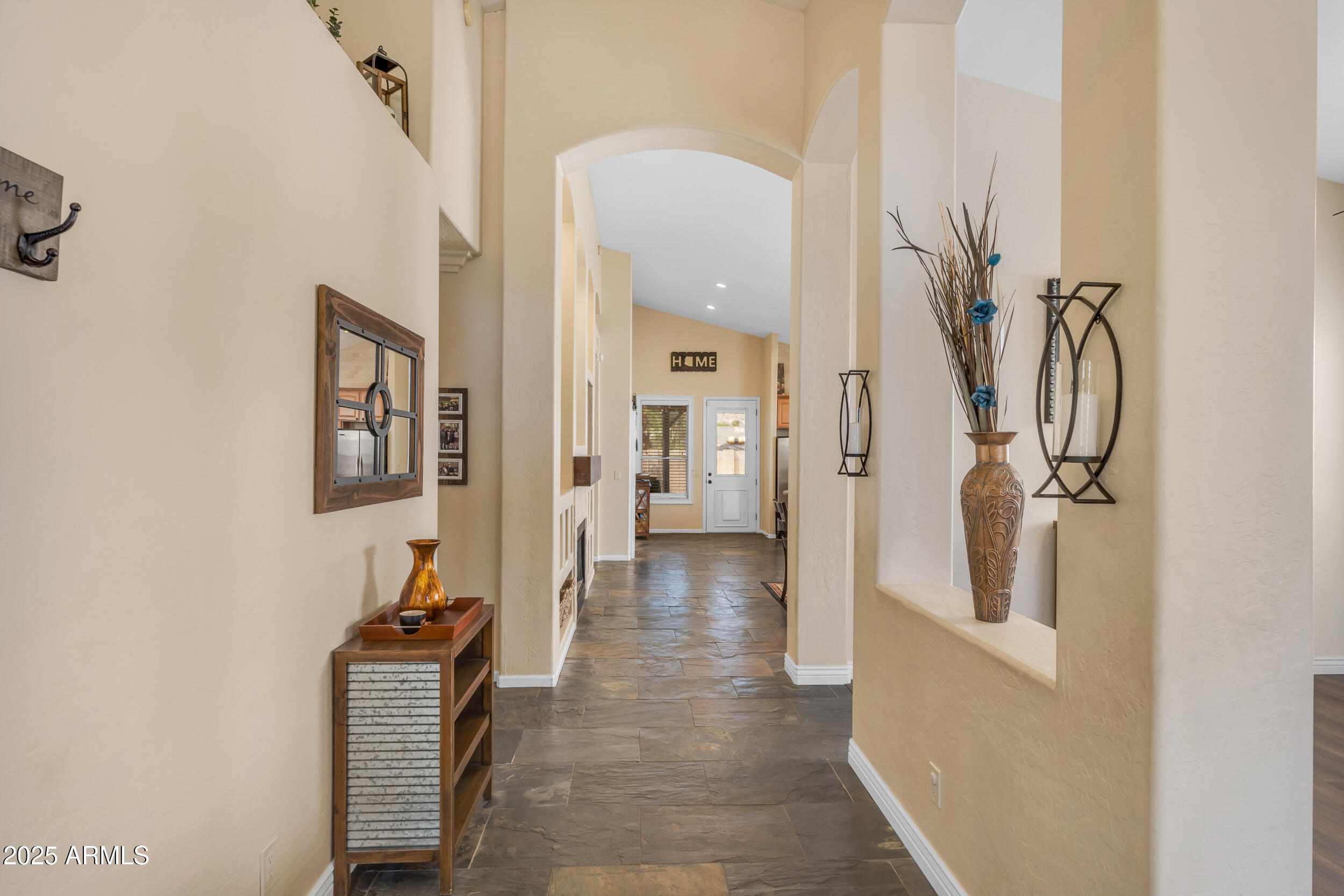 16044 South 24th Place Phoenix, AZ 85048 - Photo 4 of 42 a view of a hallway with wooden floor and staircase