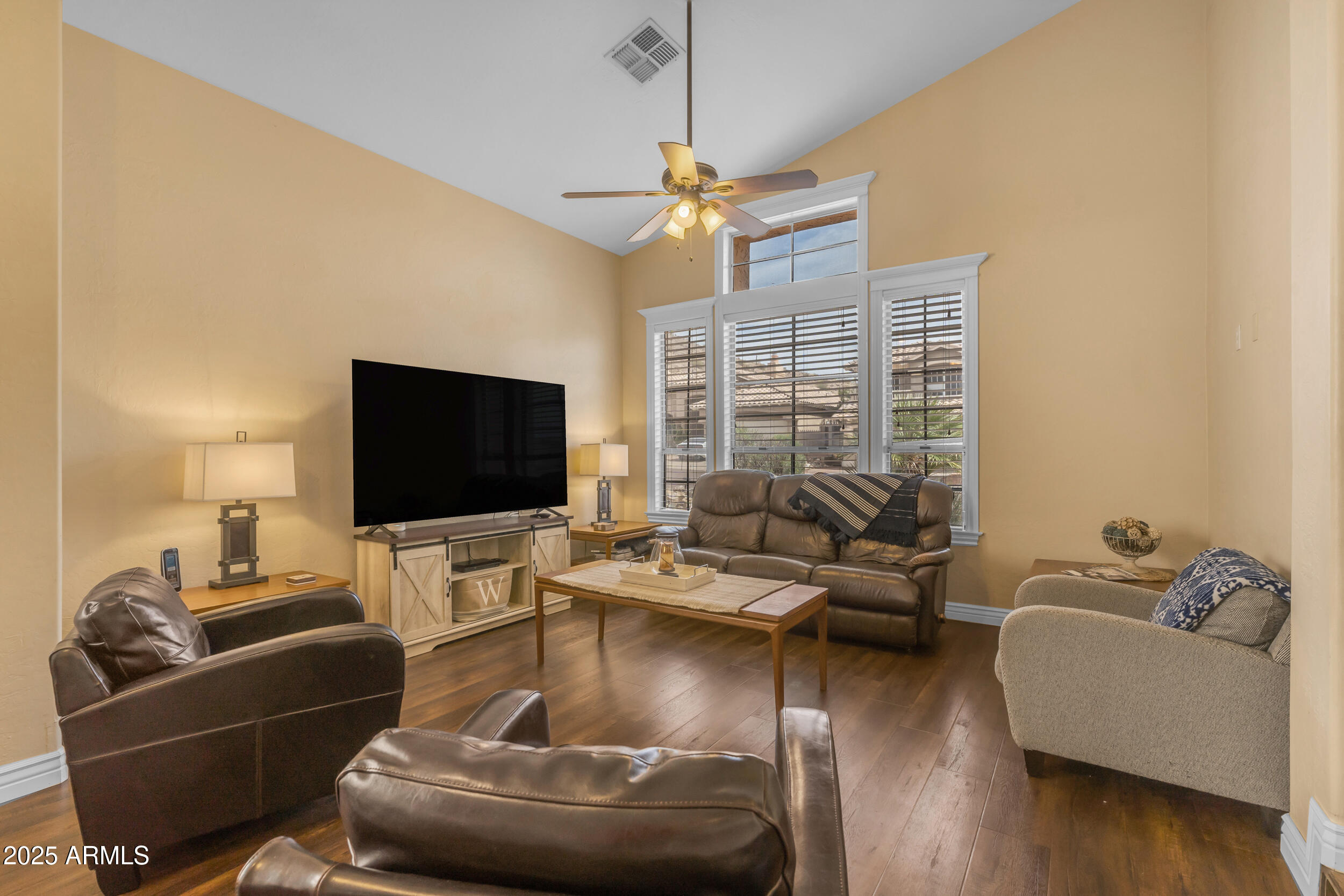16044 South 24th Place Phoenix, AZ 85048 - Photo 7 of 42 a living room with furniture and a flat screen tv