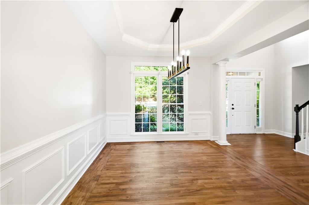 110 Mayes Farm Road Northwest Marietta, GA 30064 - Photo 7 of 49 a view of an empty room with wooden floor and a window