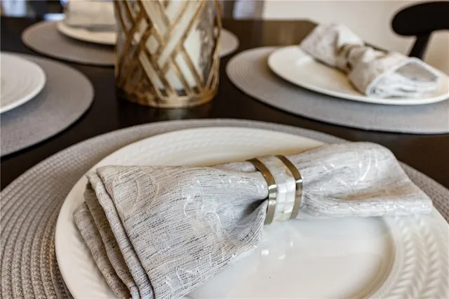 a close view of two chairs on wooden floor