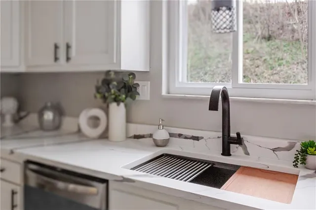 a kitchen with a sink and a window
