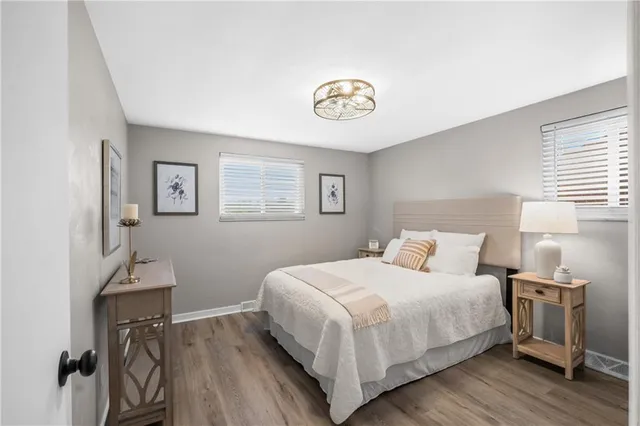 a bedroom with a bed and a table